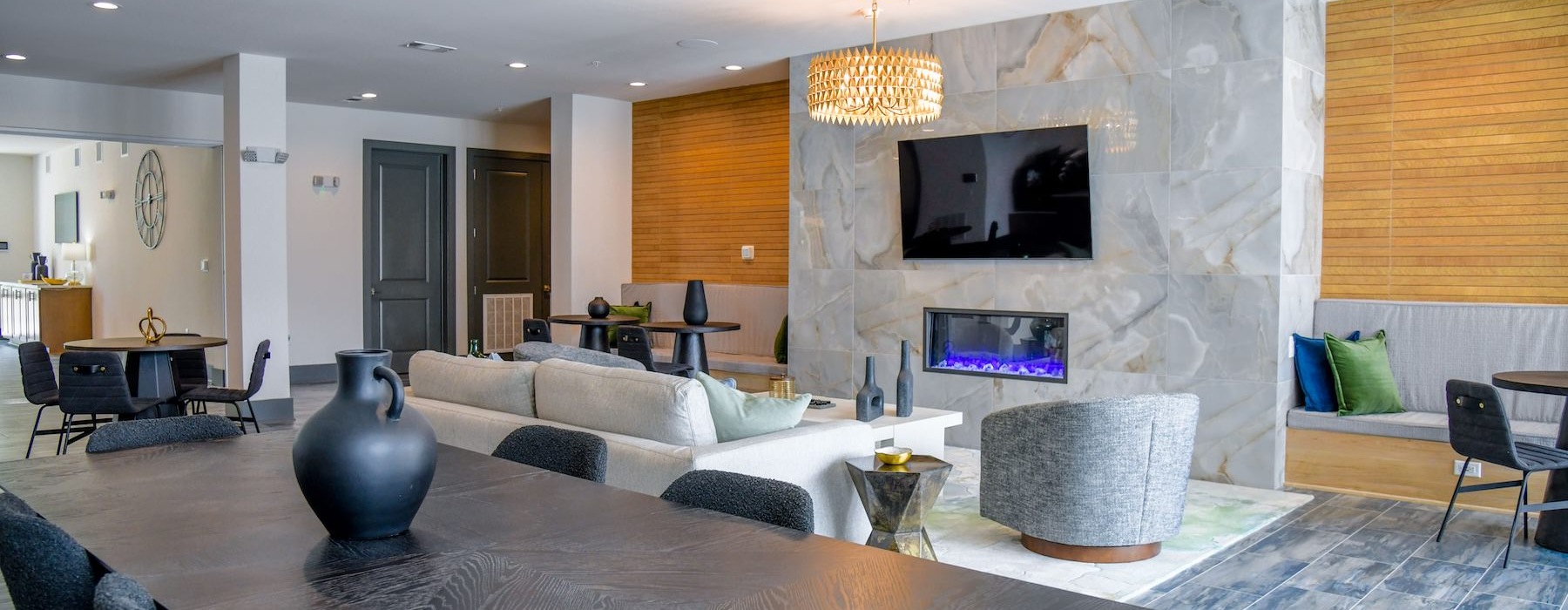 a clubroom with a couch, a tv and a table