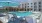 a pool with chairs and umbrellas by it