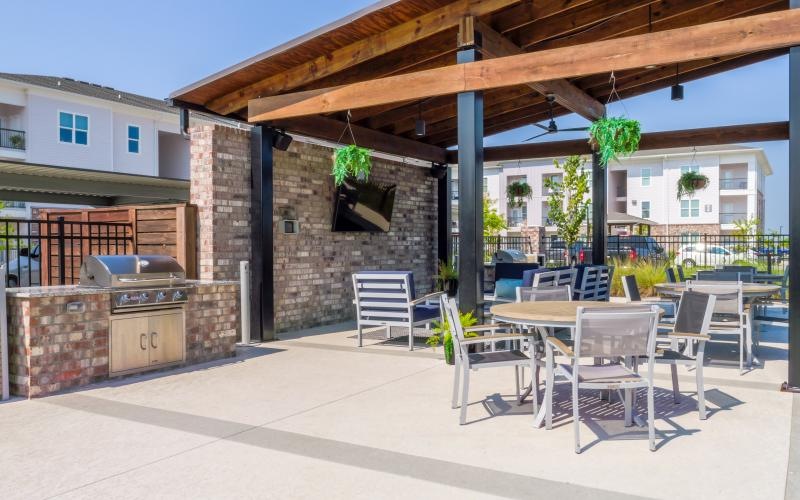 covered patio next to grill pad