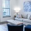 a living room with a couch and chairs
