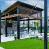 covered patio next to lawn with stringed lighting